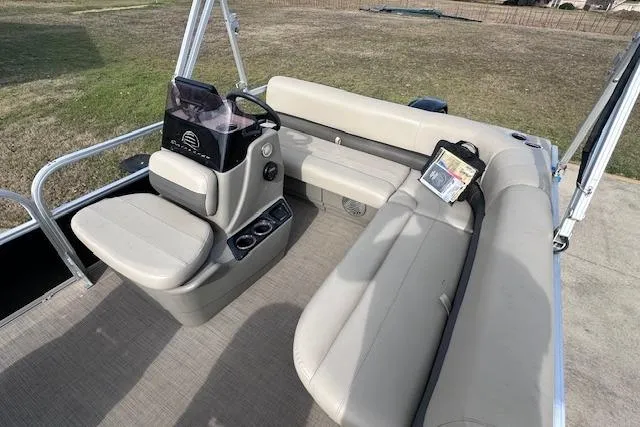 Slide: The Image of 2020 Sun Tracker Bass Buggy 16 DLX pontoon boat interior with seating and console. - 6