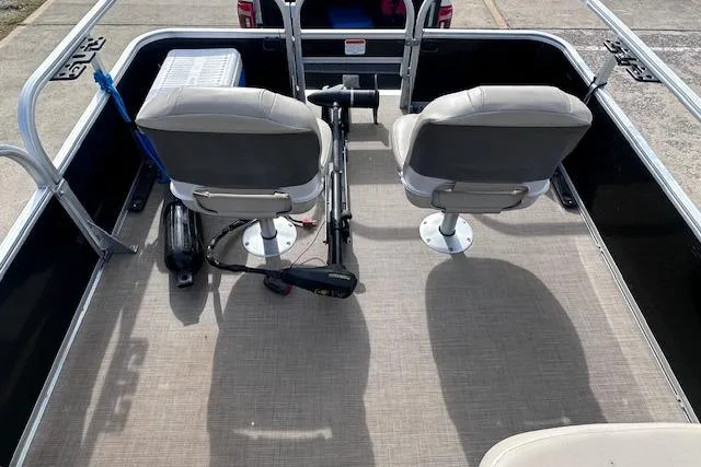 Slide: The Image of 2020 Sun Tracker Bass Buggy 16 DLX pontoon boat interior with two swivel seats. - 7