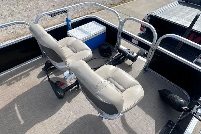 Slide: The Image of 2020 Sun Tracker Bass Buggy 16 DLX interior with seating and cooler on deck. - 8