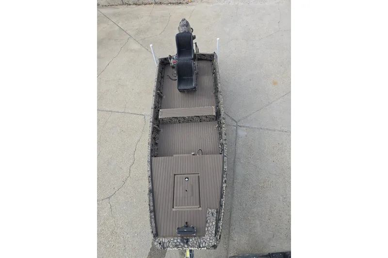 Slide: The Image of Top view of 2026 Pro-Drive 1854 SBX TD boat on concrete surface. - 10