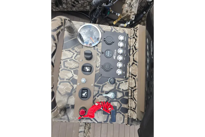 Slide: The Image of Control panel of 2026 Pro-Drive 1854 SBX TD boat with camouflage design. - 14