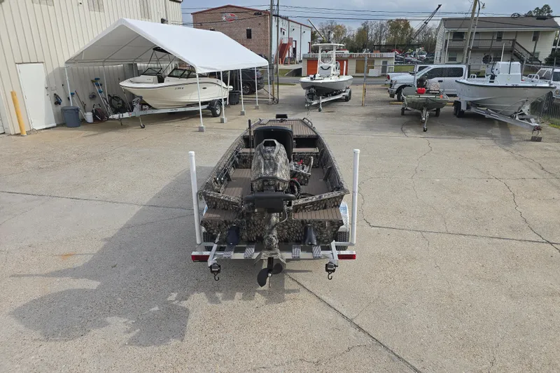 Slide: The Image of 2026 Pro-Drive 1854 SBX TD boat on trailer in outdoor showroom. - 9