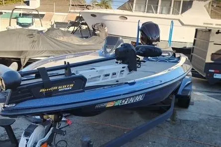 The Image of 2018 Skeeter FX21 Limited Edition boat on trailer, parked outdoors. - 0