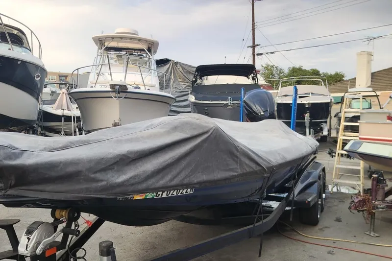 Slide: The Image of 2018 Skeeter FX21 Limited Edition boat covered in a marina storage area. - 12