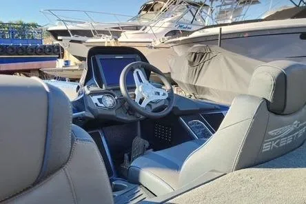 Slide: The Image of 2018 Skeeter FX21 Limited Edition boat interior with steering wheel and dashboard. - 17