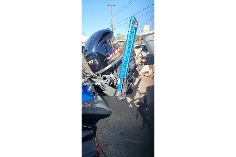 Slide: The Image of 2018 Skeeter FX21 Limited Edition boat with Yamaha outboard motor and blue power pole. - 18