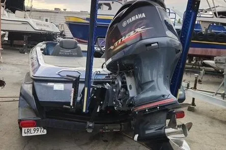 Slide: The Image of 2018 Skeeter FX21 Limited Edition boat with Yamaha outboard motor in a marina setting. - 2