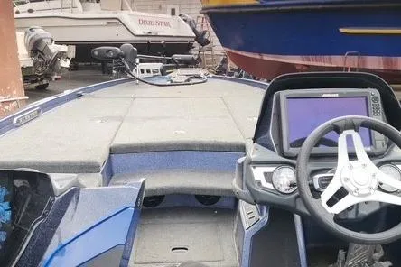 Slide: The Image of 2018 Skeeter FX21 Limited Edition boat interior with steering wheel and dashboard. - 6