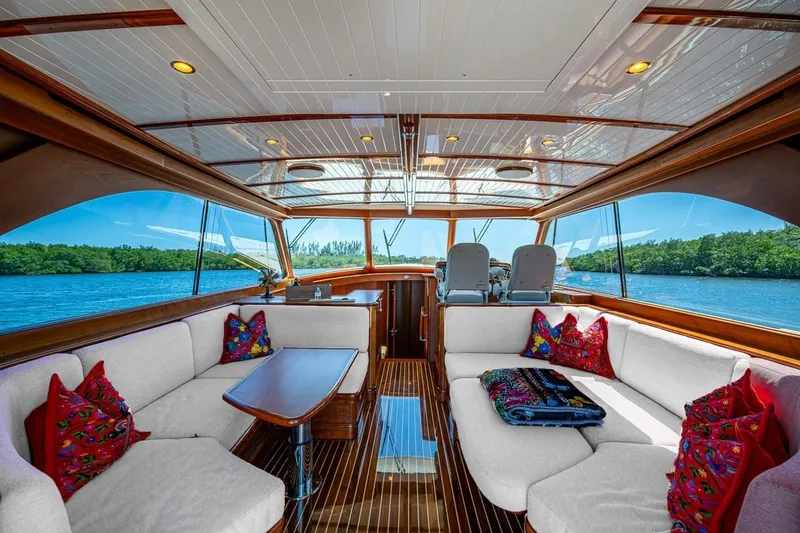Slide: The Image of Luxurious 2021 Hinckley Talaria yacht interior with elegant seating and scenic water views. - 16