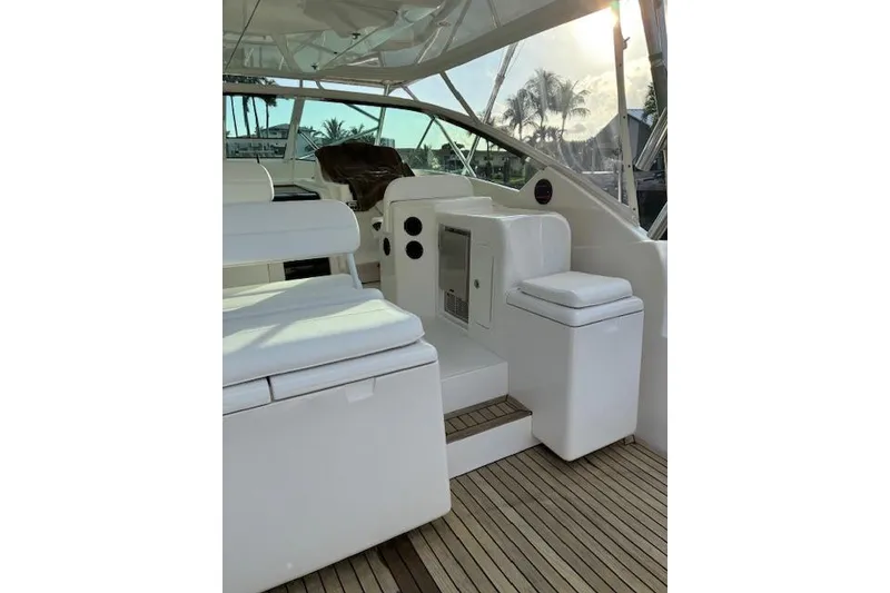 Slide: The Image of 2007 Bertram 360 yacht interior with white seating and wooden flooring. - 17