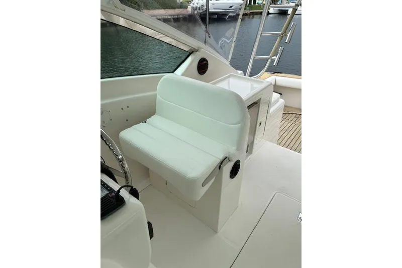 Slide: The Image of 2007 Bertram 360 boat interior with white seating and helm station. - 20