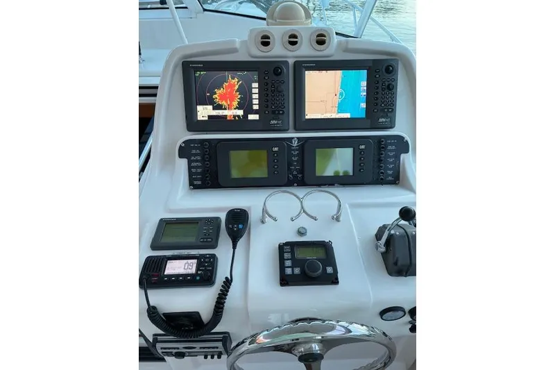 Slide: The Image of Control panel of a 2007 Bertram 360 boat with navigation and communication equipment. - 22