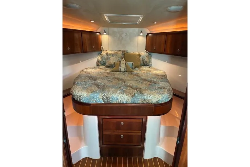 Slide: The Image of Luxurious cabin interior of 2007 Bertram 360 yacht with cozy bedding and wooden cabinetry. - 30