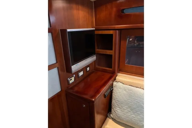Slide: The Image of Interior of 2007 Bertram 360 yacht with wood paneling and built-in TV. - 33