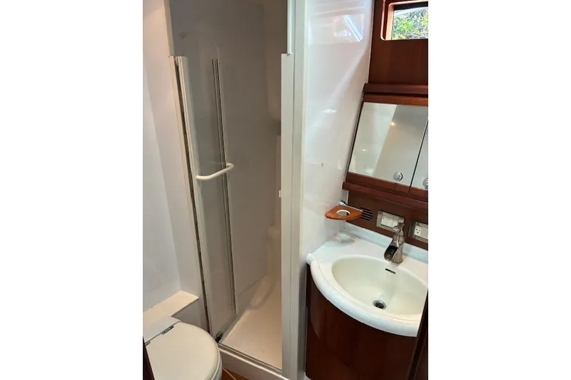 Slide: The Image of Bathroom interior of 2007 Bertram 360 yacht with shower and sink. - 38
