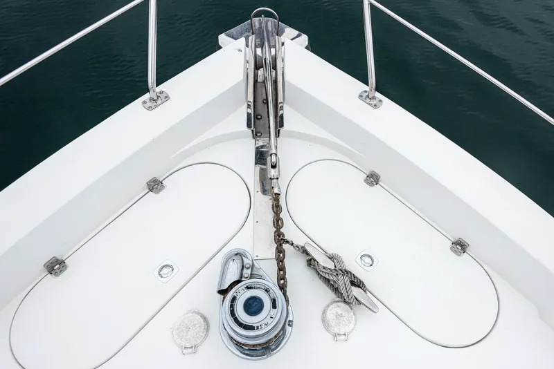 Slide: The Image of Bow of 2005 Carver 560 Voyager yacht with anchor chain and winch. - 10
