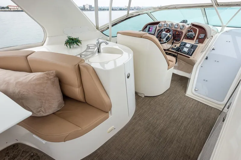 Slide: The Image of Luxurious interior of 2005 Carver 560 Voyager yacht with helm and seating area. - 14