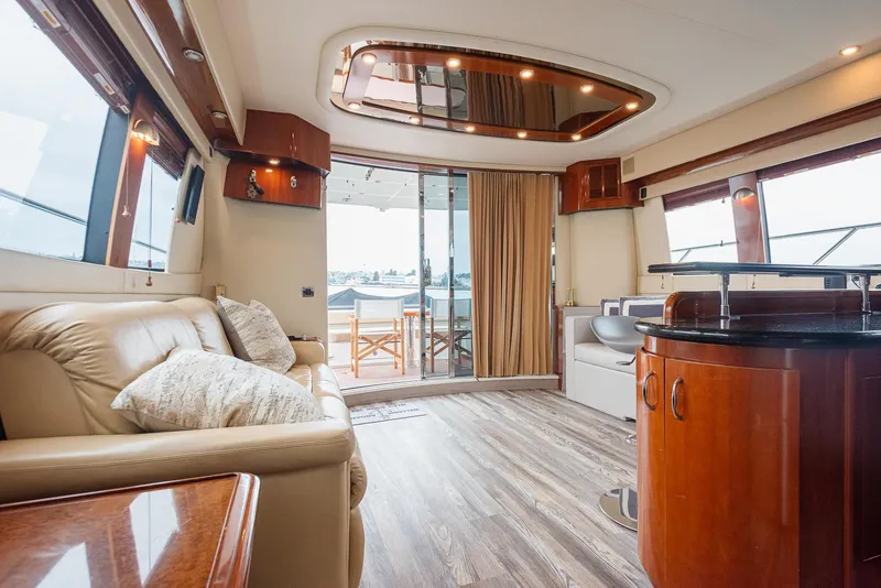 Slide: The Image of Luxurious interior of 2005 Carver 560 Voyager yacht with elegant furnishings and wood accents. - 30