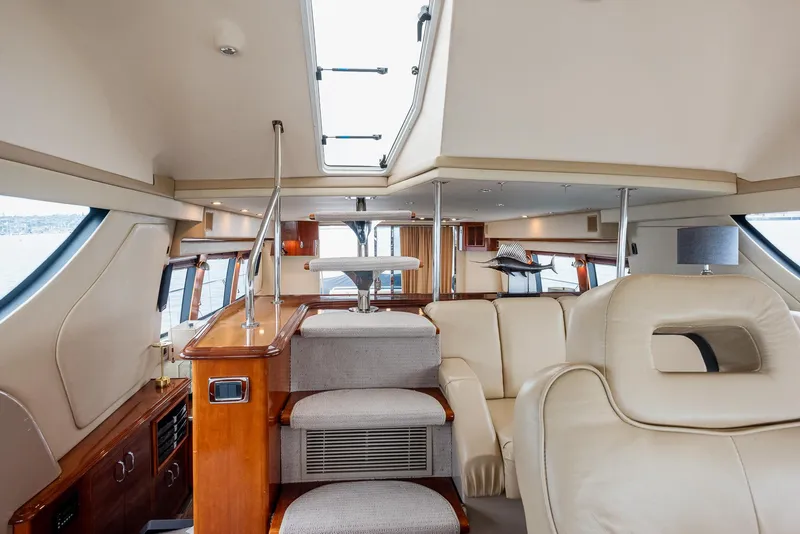 Slide: The Image of Luxurious interior of 2005 Carver 560 Voyager yacht with plush seating and elegant design. - 41