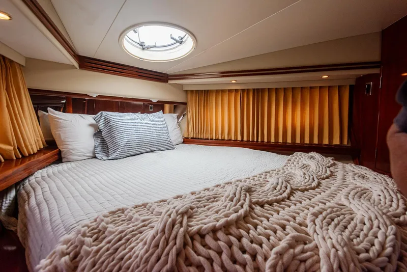 Slide: The Image of Luxurious bedroom interior of 2005 Carver 560 Voyager yacht with cozy bedding. - 43