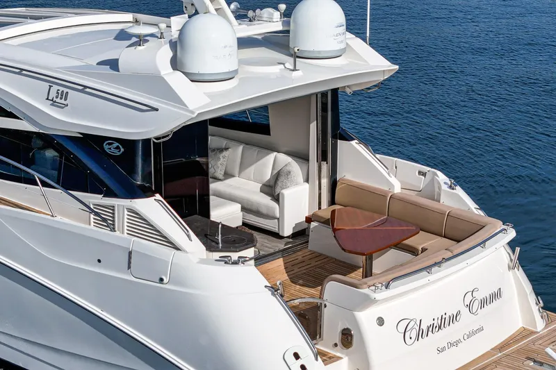 Slide: The Image of Luxurious 2016 Sea Ray L590 yacht with elegant seating, cruising on calm waters. - 16