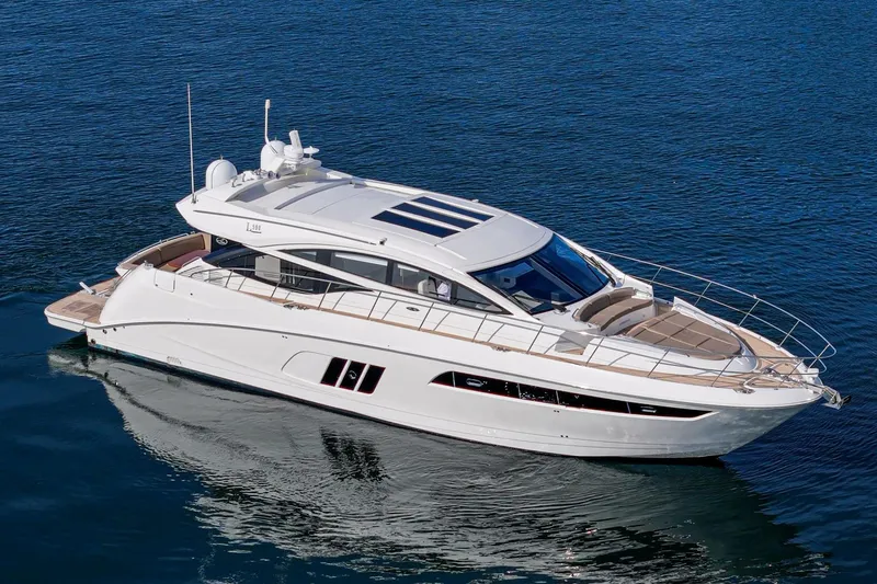 Slide: The Image of 2016 Sea Ray L590 luxury yacht cruising on calm blue waters. - 3