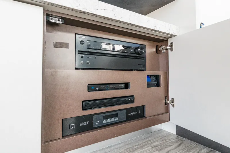 Slide: The Image of Audio-visual equipment cabinet on 2016 Sea Ray L590 yacht. - 32