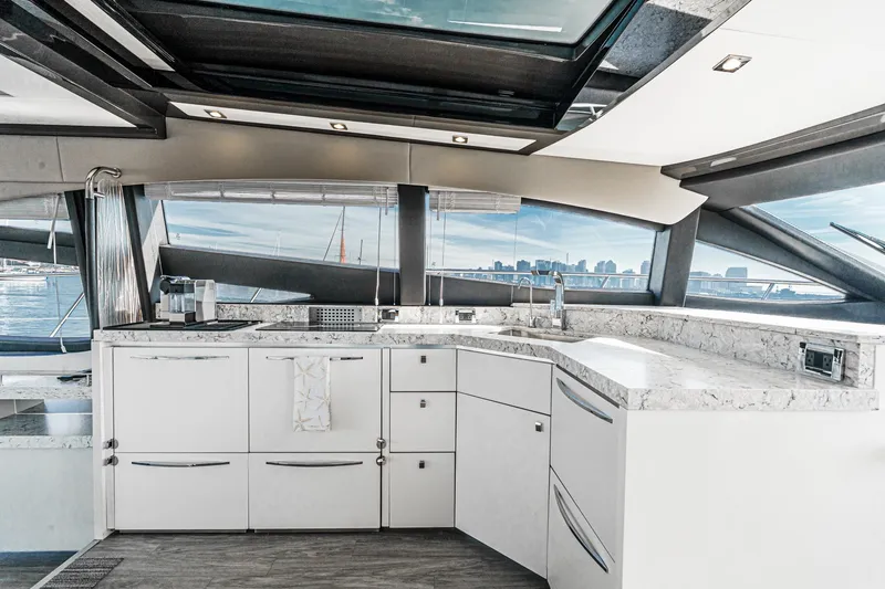Slide: The Image of Luxurious 2016 Sea Ray L590 yacht interior with modern kitchen and panoramic windows. - 34