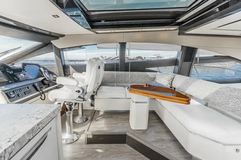 Slide: The Image of Luxurious interior of 2016 Sea Ray L590 yacht with modern helm and seating area. - 40