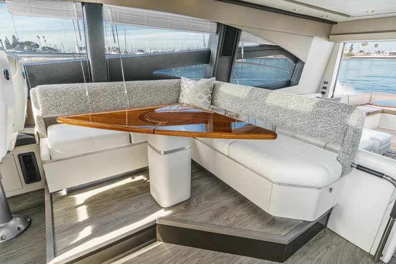 Slide: The Image of Luxurious interior of 2016 Sea Ray L590 yacht with elegant seating and wooden table. - 41