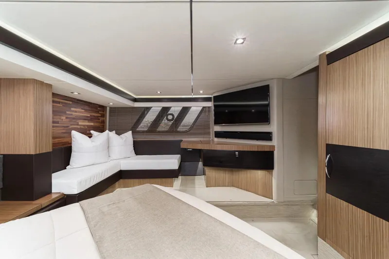 Slide: The Image of Luxurious interior of 2016 Sea Ray L590 yacht with modern wood finishes and cozy seating. - 52