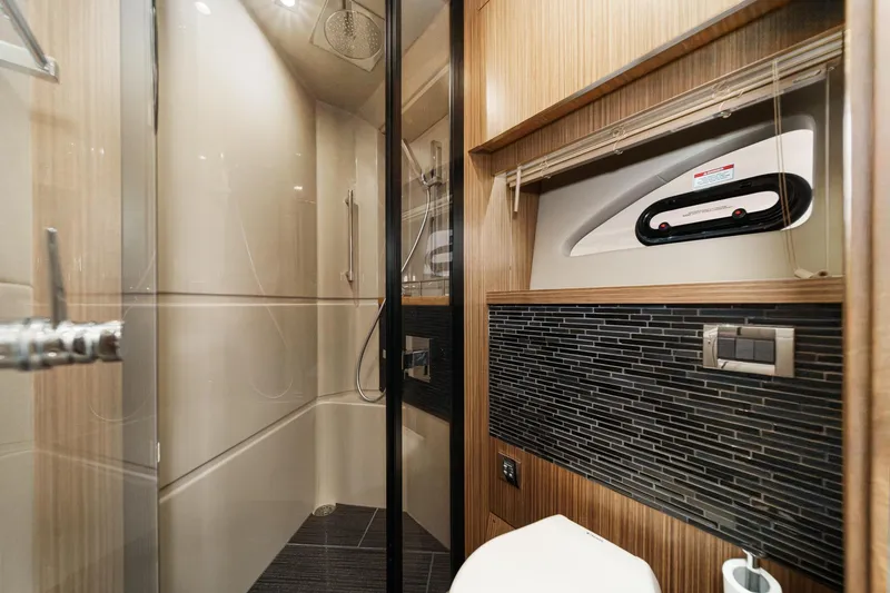 Slide: The Image of Luxurious bathroom interior of 2016 Sea Ray L590 yacht with modern shower and sleek design. - 55