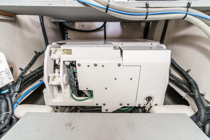 Slide: The Image of Engine room of 2016 Sea Ray L590 yacht with visible wiring and machinery. - 59