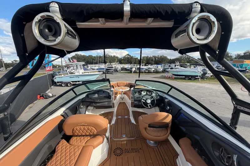 Slide: The Image of Luxurious interior of a 2016 Monterey 218 Surf boat with tan leather seating. - 14