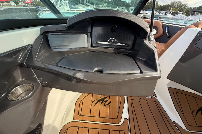 Slide: The Image of Control panel of 2016 Monterey 218 Surf boat with throttle and switches. - 19