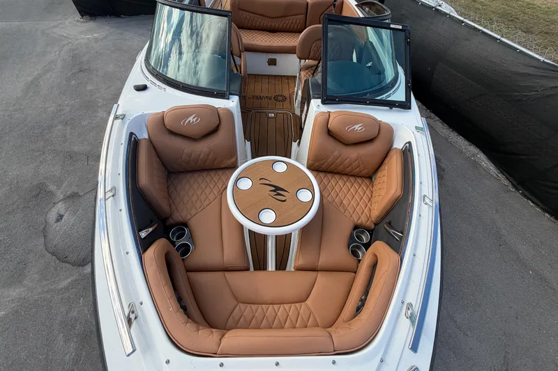 Slide: The Image of 2016 Monterey 218 Surf boat with tan leather seating and sleek design. - 23