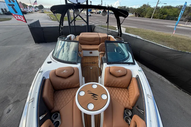 Slide: The Image of 2016 Monterey 218 Surf boat interior with tan leather seats and open windshield. - 24