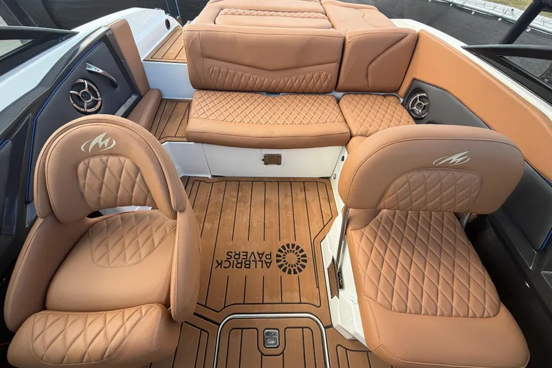 Slide: The Image of 2016 Monterey 218 Surf boat interior with tan leather seating and wood flooring. - 27
