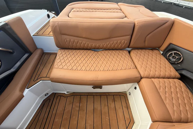 Slide: The Image of Luxurious tan seating on 2016 Monterey 218 Surf boat, featuring diamond stitching. - 29