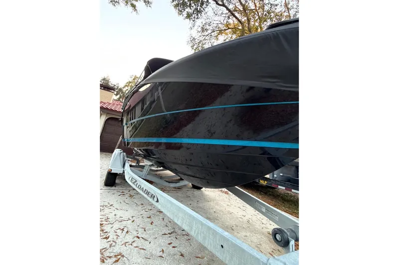 Slide: The Image of Rear view of a 2016 Monterey 218 Surf boat with propeller and ladder. - 3