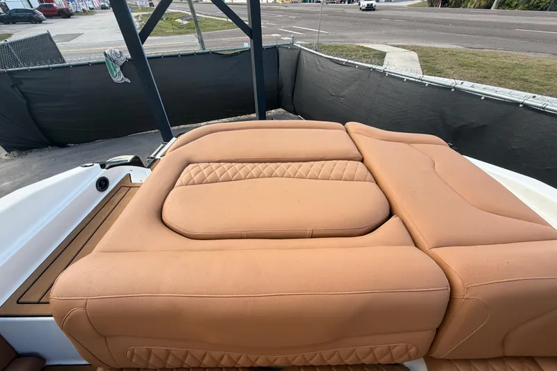 Slide: The Image of 2016 Monterey 218 Surf boat with tan leather seating and teak-style deck. - 30