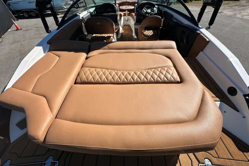 Slide: The Image of 2016 Monterey 218 Surf boat interior with tan leather seating and modern dashboard. - 32