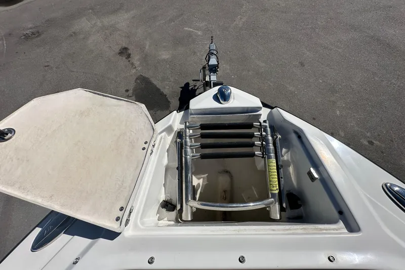 Slide: The Image of 2016 Monterey 218 Surf boat with open storage compartment and ladder. - 39