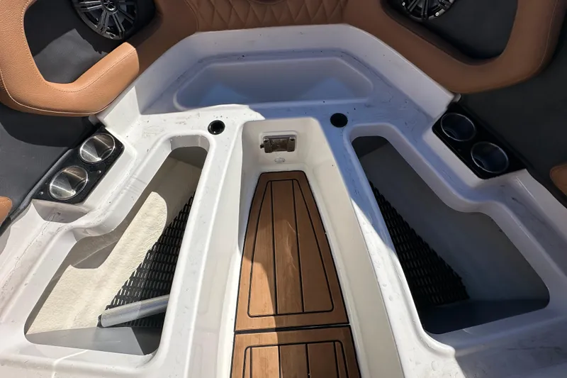 Slide: The Image of Interior of 2016 Monterey 218 Surf boat with cup holders and speakers. - 42