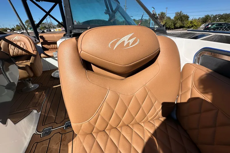 Slide: The Image of Luxurious brown leather seating on 2016 Monterey 218 Surf boat, featuring quilted design. - 49