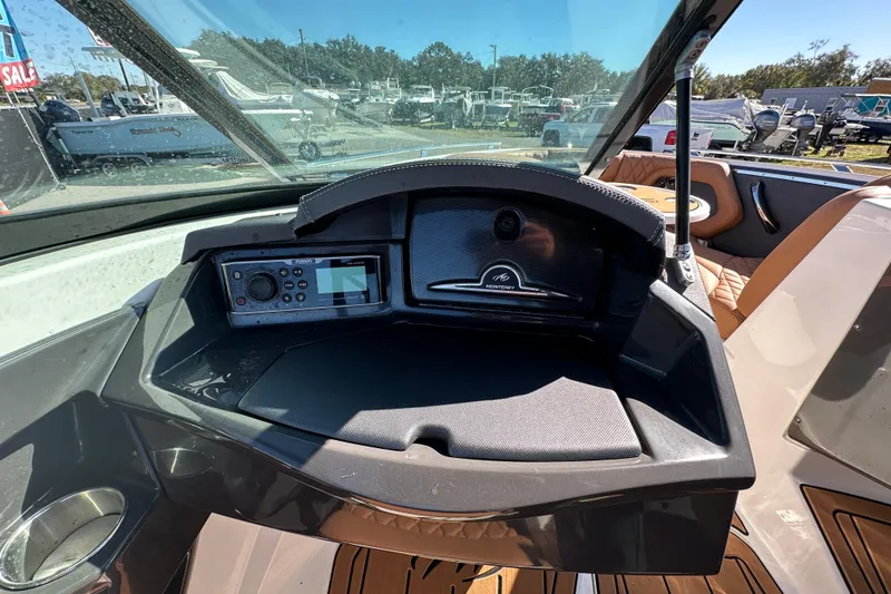 Slide: The Image of Interior dashboard of a 2016 Monterey 218 Surf boat with control panel. - 52