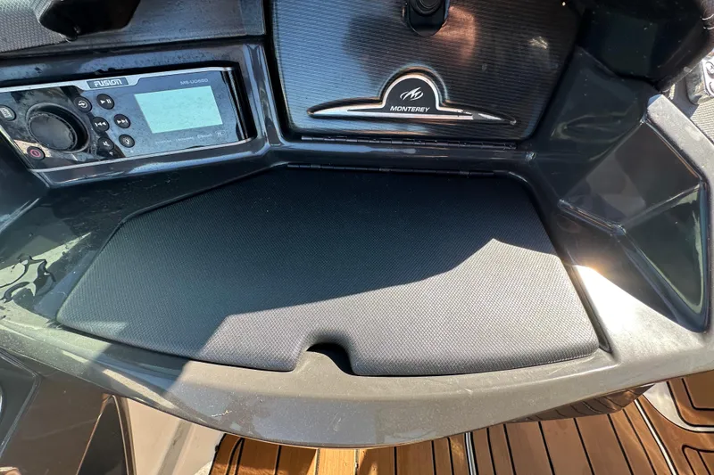 Slide: The Image of 2016 Monterey 218 Surf dashboard with Fusion audio system and storage compartment. - 53