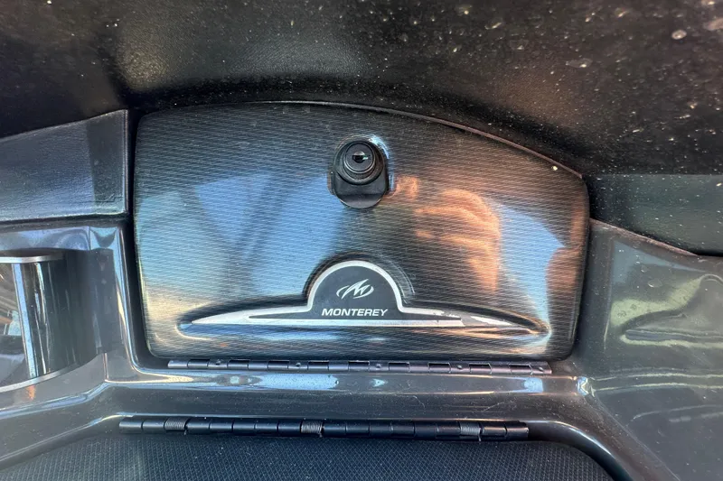 Slide: The Image of 2016 Monterey 218 Surf dashboard with logo and reflective surface. - 56