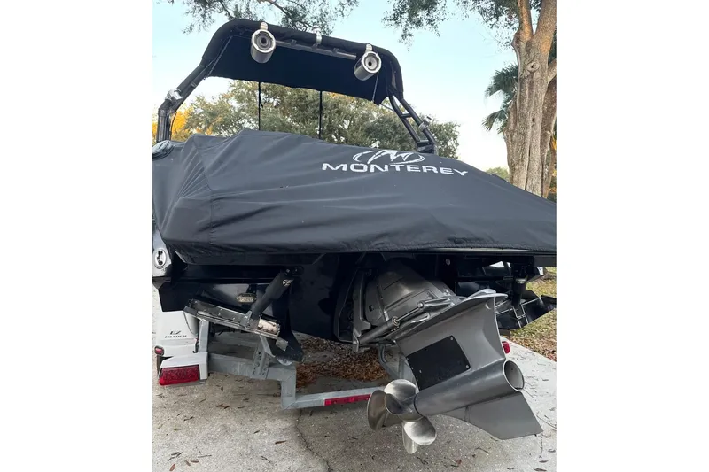 Slide: The Image of 2016 Monterey 218 Surf boat on trailer under clear blue sky. - 6