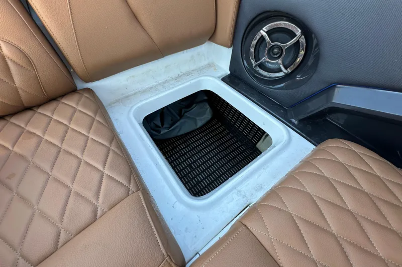 Slide: The Image of Brown quilted seats and speaker in 2016 Monterey 218 Surf boat interior. - 64